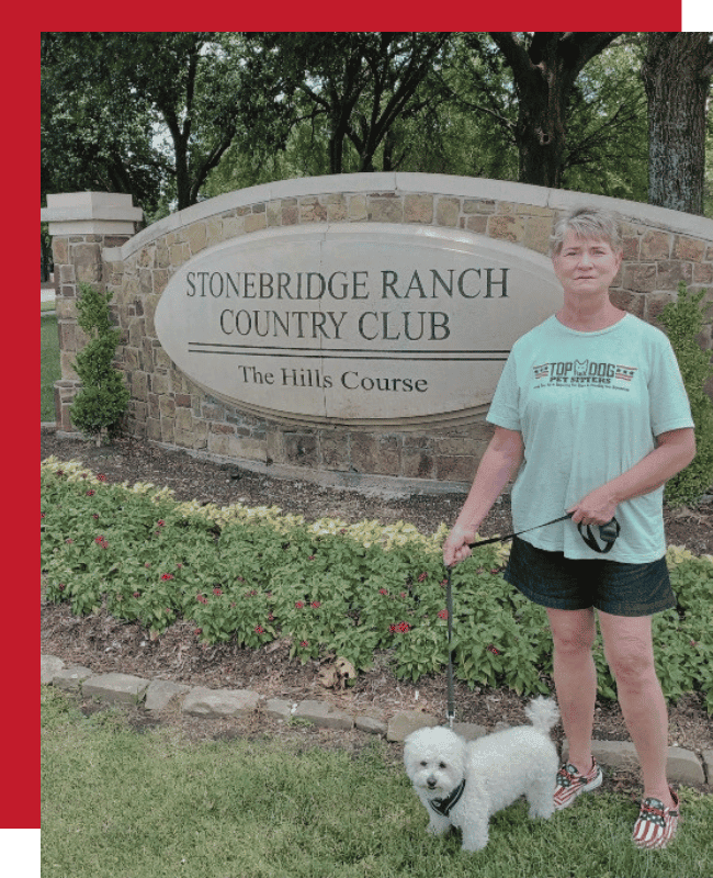 Susan walking a dog in Stonebridge Ranch during a dog walking visit