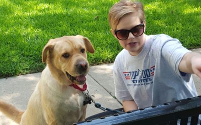Dog and pet sitter enjoying time outdoors in McKinney.