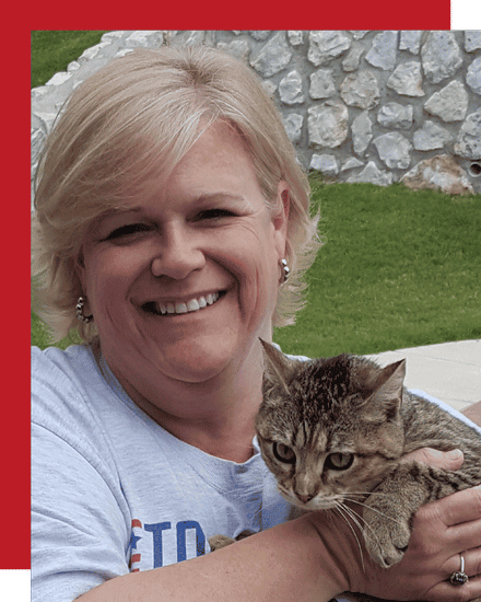 cat sitter posing with cat at a cat sitting visit
